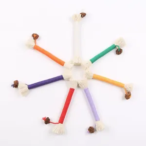 Colorful cotton rope cat chew toy with tassels and gall fruit for pet teeth cleaning and fun.