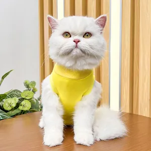 Detailed shot of a soft yellow cat recovery suit, elastic post-surgery wear for pets.