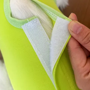 Pet recovery suit detail showing secure hook and loop fastener and soft elastic fabric for cats.