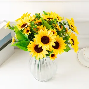 Artificial sunflower bouquet in glass vase, vibrant yellow silk flowers for home decor.