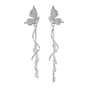 French butterfly tassel earrings with pearls and crystals, elegant dangling design for women.