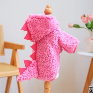 Cute pink plush dinosaur pet hoodie detail view, warm winter dog costume with soft spikes.