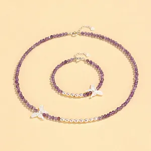 Elegant purple faceted crystal and white pearl jewelry set with delicate butterfly charms