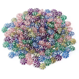 Detailed view of colorful plastic pumpkin beads with silver plated edges for DIY jewelry crafts.