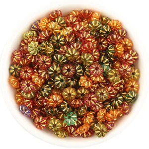 Colorful plastic pumpkin beads with metallic edge for DIY jewelry making, bracelets, and necklaces.