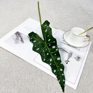 Artificial alocasia leaf detail view, realistic botanical green plant for wall decor and home interior.