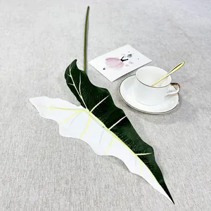 Artificial elephant ear plant leaf detail, decorative green foliage for home room wall decor.