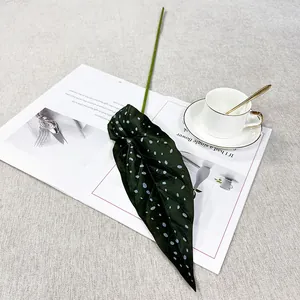 Artificial green plant single leaf decorative prop for living room home decor setup.