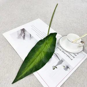 Artificial alocasia leaf detail view, realistic green plant decor for home, wall and living room.