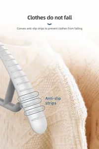Detailed view of grey wide shoulder non slip clothes hanger showing anti slip texture features.