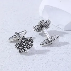 Detailed close-up view of vintage silver maple leaf cufflinks for men business shirts.