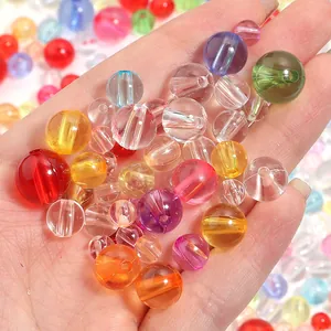 Close-up view of colorful transparent acrylic round beads for DIY jewelry making accessories.