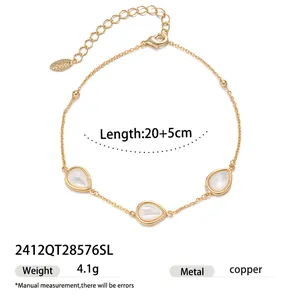 Detail view of the elegant gold-plated copper teardrop mother-of-pearl charm chain bracelet.