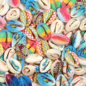 Close-up detail of colorful painted cowrie shell beads with cute turtle and floral patterns.