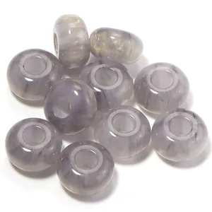 Close-up detail of grey marbled resin large hole beads for DIY jewelry and phone chain making.