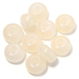 Closeup of milky white resin cat's eye abacus beads, ideal for DIY phone charms.