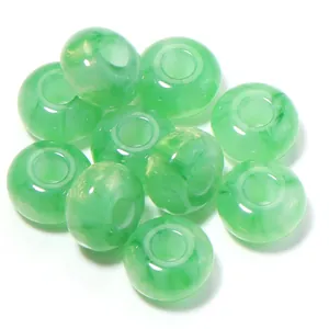 Close-up detail of green resin large-hole loose beads, ideal for DIY jewelry crafting.