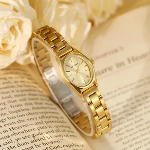 Élégante montre dorée pour femme avec logo Bee Sister sur cadran ovale, décor roses et livre