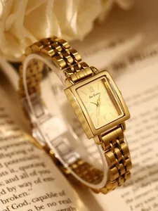 Elegant gold-tone vintage square watch for women with metal strap.