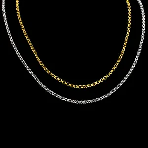 Close-up of 2mm gold and silver stainless steel Rolo link chains on black background