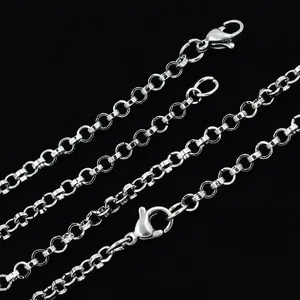 Close-up macro view of 2mm silver stainless steel rolo chain necklace links and clasp
