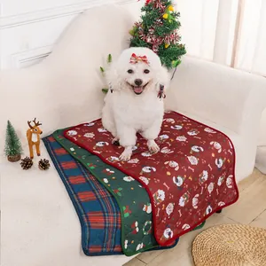 Christmas pet mat detail showing festive dog and Santa print design on sofa setup.