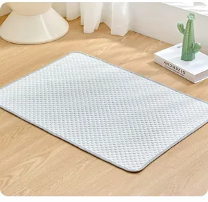 Premium gray honeycomb texture pet cooling mat displayed on a light wooden floor