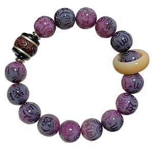 Traditional purple Bodhi bead bracelet featuring engraved Six-Syllable Mantra and ring charm