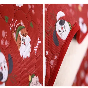 Christmas pet mat fabric detail close-up showing cute holiday dog pattern and quilted texture.