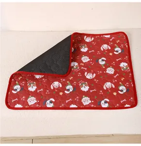 Red Christmas pet pee pad with non-slip backing and cute cartoon cat dog print detail.
