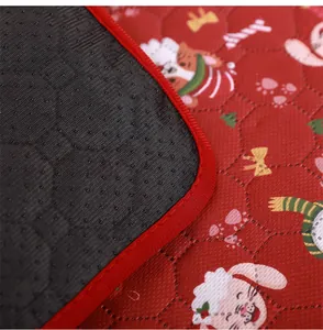 Close-up detail of Christmas pet mat showing soft quilted fabric and black anti-slip backing.