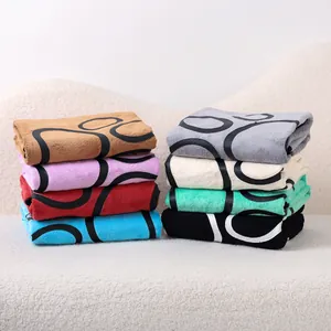 Reusable coral fleece absorbent pet training pads with circular patterns in multi-color set