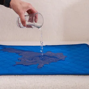 Blue washable absorbent pet mat for dogs demonstrating superior water absorption