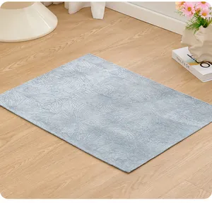 Close-up view of light blue non-slip pet mat featuring elegant floral pattern texture
