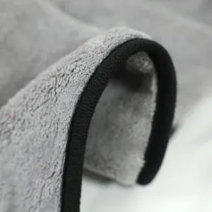 Soft grey coral fleece pet bath towel with absorbent texture and black piping detail.