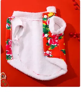Close-up showing the soft white fleece lining of a festive floral pet dog vest