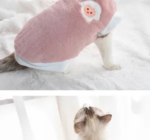 Close-up of pink plush pet vest with cute sheep embroidery for cats and small dogs