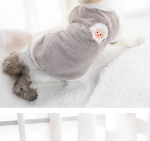 Close-up of a warm grey pet fleece vest with a cute cartoon sheep patch detail