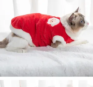Detail view of a plush red Christmas pet vest with Santa patch on a Ragdoll cat