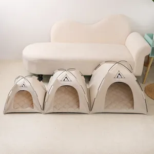 Three sizes of cream pet tents for dogs and cats in a cozy living room setting
