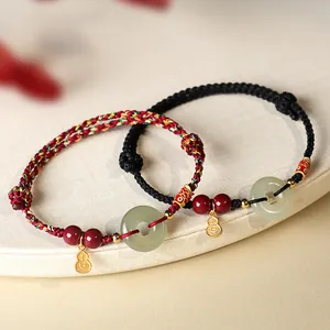 Bracelets ethniques faits main en corde rouge et noire avec jade Hetian et perles cinabre