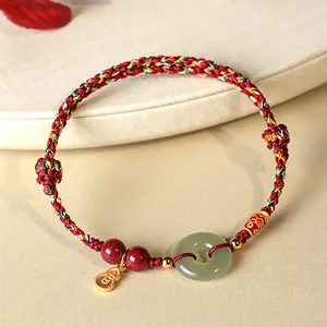 Bracelet cordon rouge tressé main avec boucle en jade Hetian et breloque gourde dorée