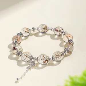 Eleganter 12mm Natur-Schwarzgold-Super-Seven-Kristallarmband mit Blatt-Anhänger