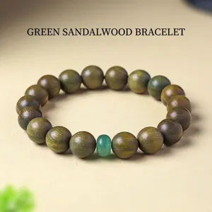 Natural green sandalwood beaded bracelet with a vintage green aventurine bead accent.