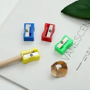 Detail view of colorful square plastic pencil sharpeners with pencil and shavings