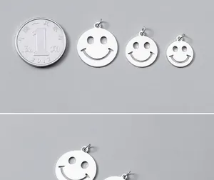 Close-up detail of S925 sterling silver hollow smiley face charms in three different sizes