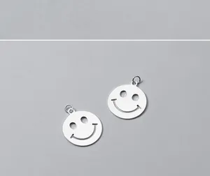 Macro view of S925 sterling silver hollow smiley face charms for DIY jewelry making