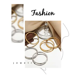 Detail shot of minimalist titanium steel open bracelets in gold and silver finish.