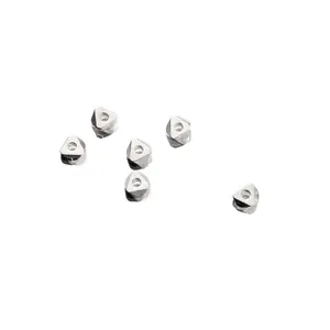 Detailed macro shot of 925 sterling silver geometric triangular spacer beads for DIY.