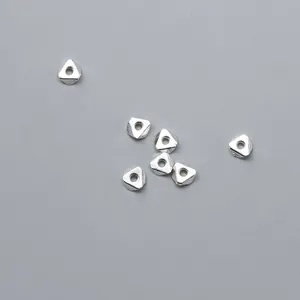 Detailed view of faceted 925 sterling silver triangle spacer beads for DIY jewelry